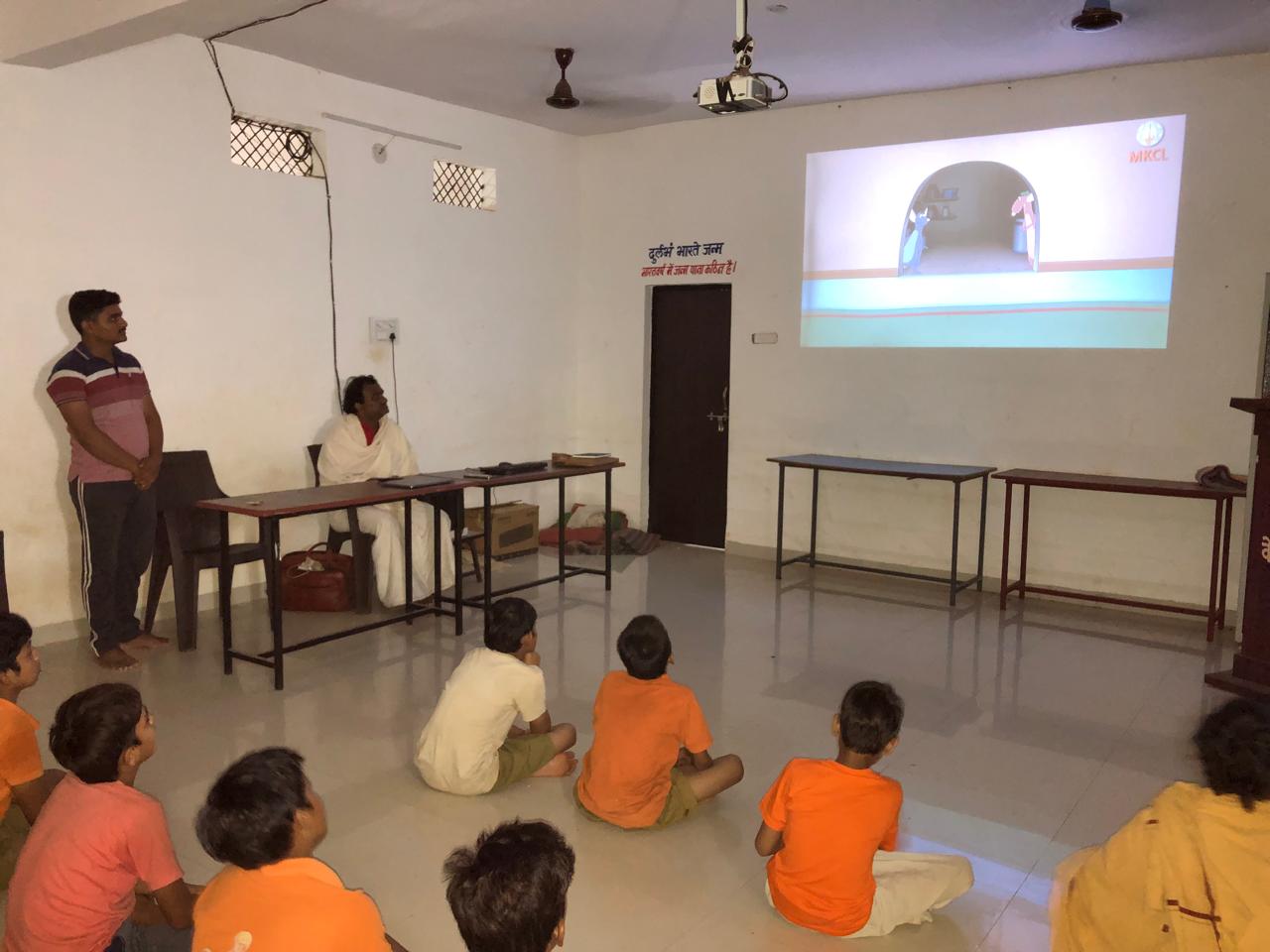 Students attending modern classroom presentation